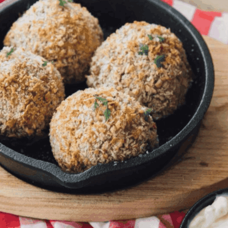 Carrabba’s Italian Grill Arancini served golden and crispy with marinara dipping sauce.