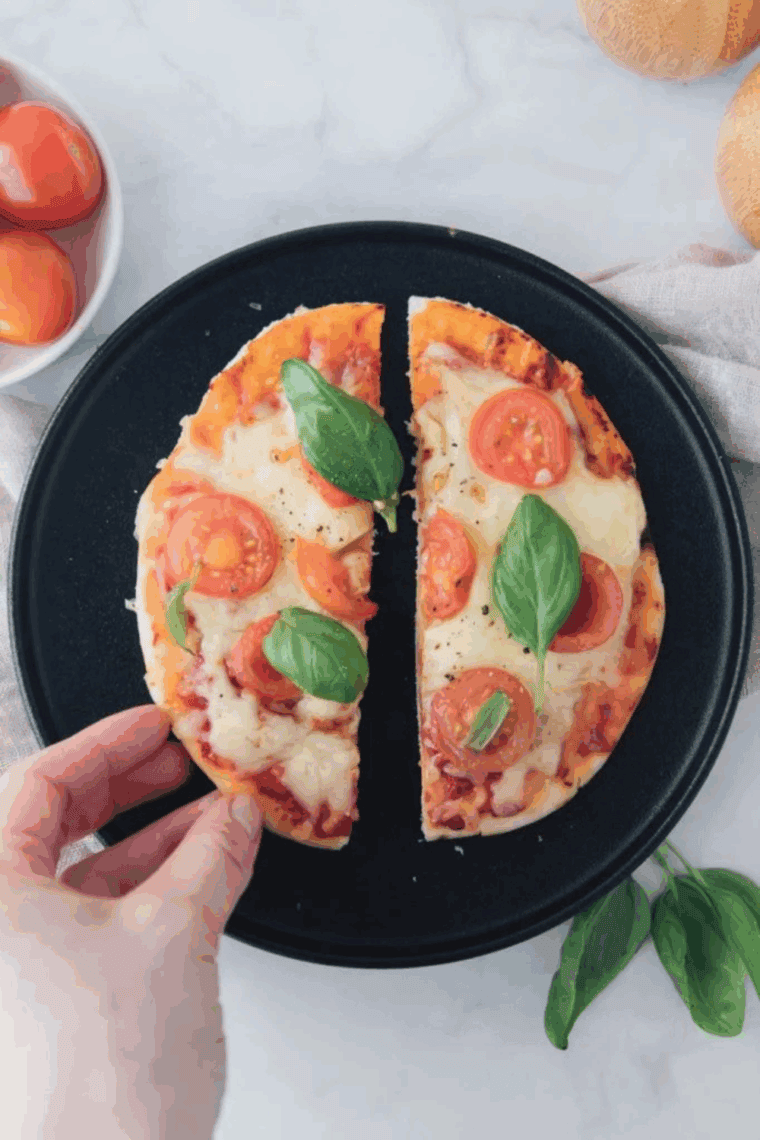 Homemade Cheesecake Factory Margherita Flatbread Pizza with crispy crust, melted mozzarella, fresh basil, and sliced tomatoes.