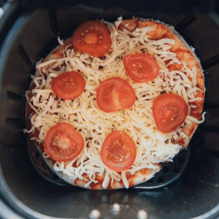 Add the Cheesecake Factory Margherita Flatbread Pizza Recipe to the air fryer basket.