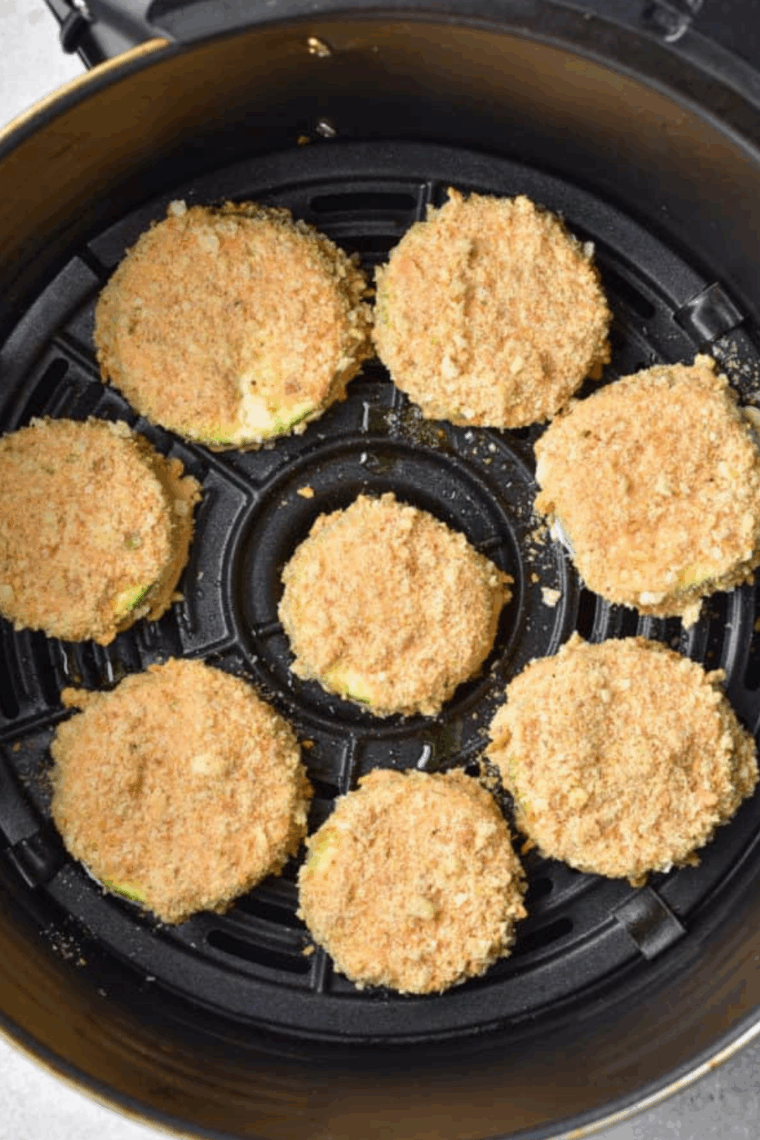Place Cheesecake Factory’s Air Fryer Fried Zucchini in the air fryer basket.