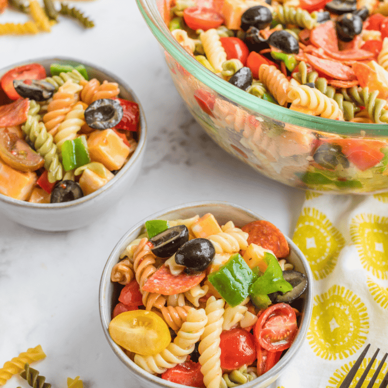 Bowl of vibrant Copycat Suddenly Salad Classic with tri-color rotini, fresh vegetables, and creamy dressing.