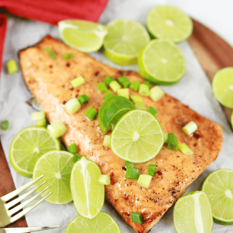 Delicious Copycat Texas Roadhouse Salmon Recipe with butter, lime, and sweet chili sauce.