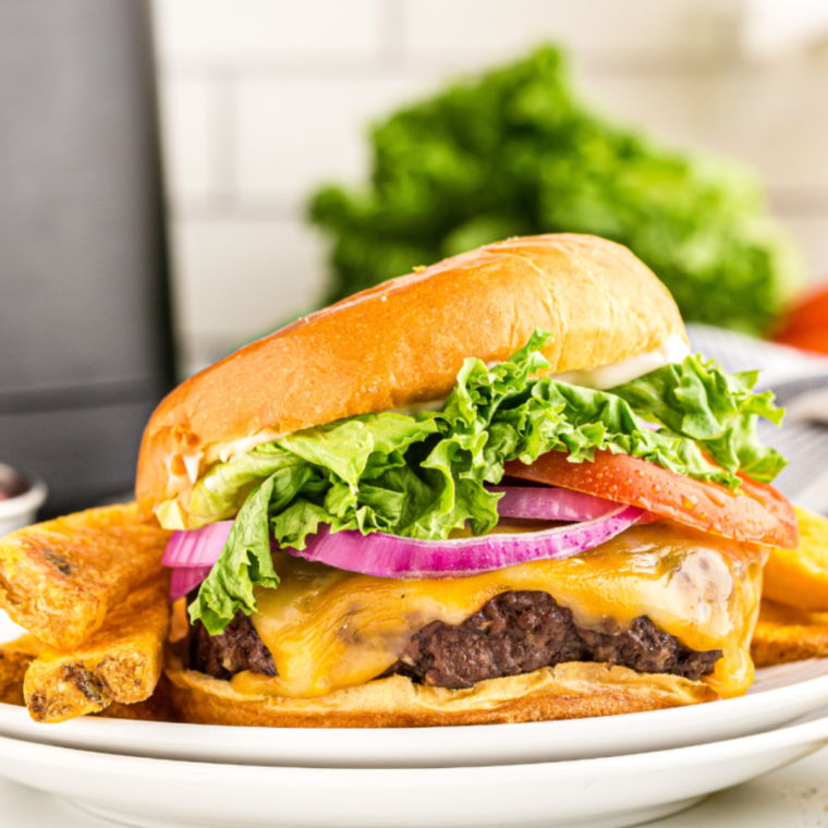 Homemade Wendy's Dave's Single burger on a plate with fresh toppings.