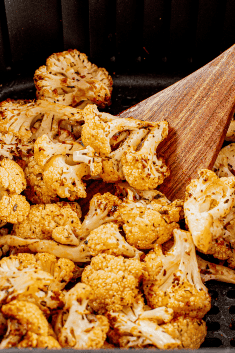 Golden crispy air fryer frozen cauliflower in a bowl, ready to serve.