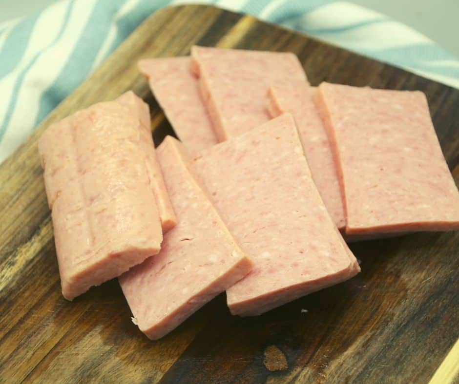 slices of SPAM on a wooden cutting board