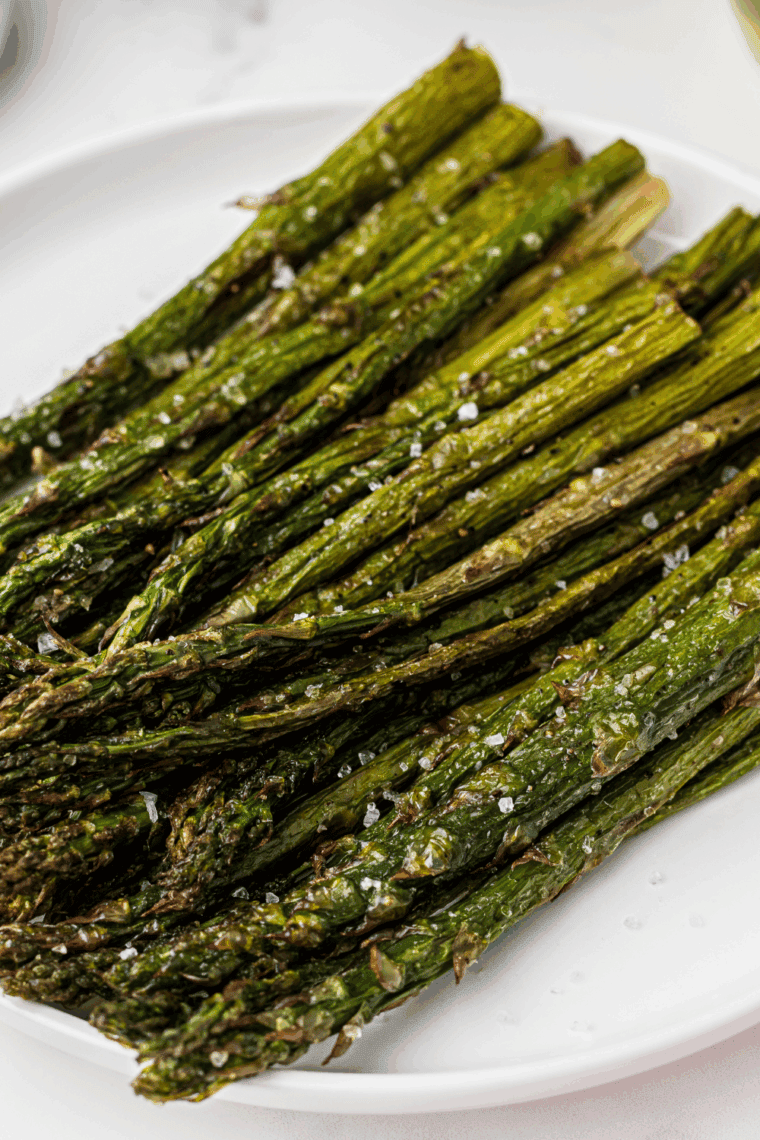 Ninja Foodi Grill asparagus cooking until tender and lightly charred