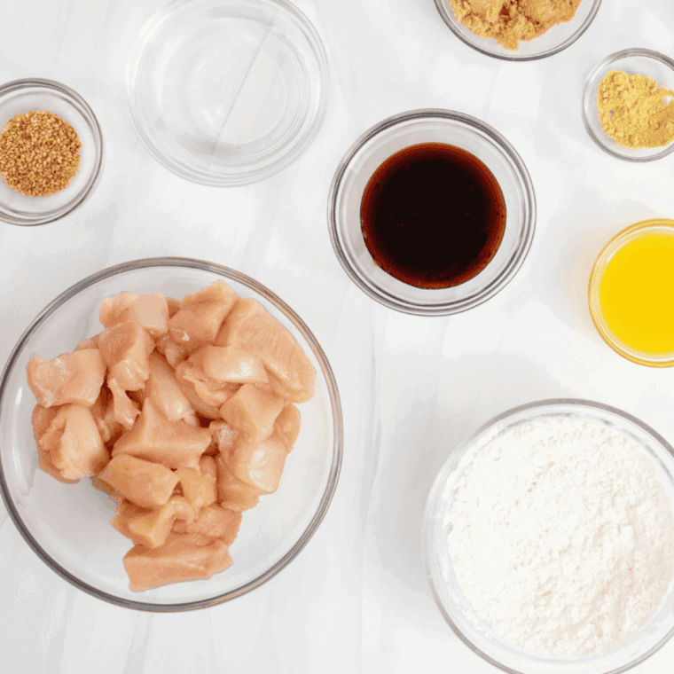 Ingredients needed for Panda Express Honey Sesame Chicken Recipe on kitchen table.