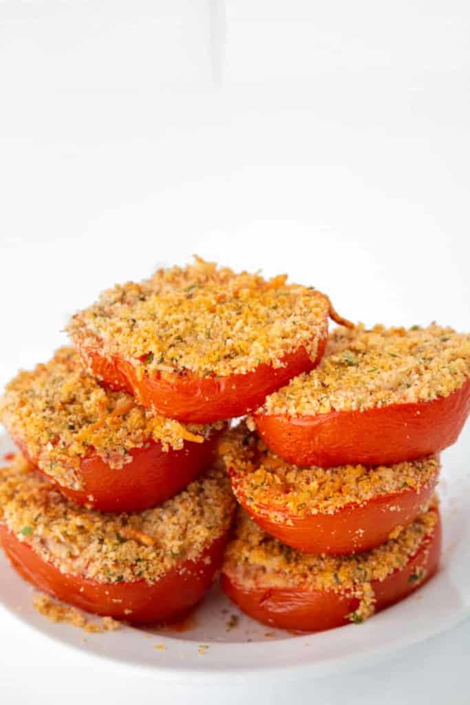 Here are some pro tips to help you get the best results when making Air Fryer Parmesan Tomatoes:

Select the Right Tomatoes: Use firm, ripe tomatoes for this recipe. Too soft, and they may become mushy; too hard, and they won't roast properly.

Slice Evenly: Try to slice your tomatoes evenly to ensure they cook at the same rate.

Season Generously: Don't be shy with your seasoning. Tomatoes can handle a good amount of flavor, so feel free to be generous with the Parmesan cheese and spices.

Watch Your Cooking Time: Every air fryer can vary slightly in temperature, so keep a close eye on your tomatoes to prevent them from burning. They should be done when the cheese is golden and crispy.

Use Freshly Grated Cheese: If possible, use freshly grated Parmesan cheese as it tends to melt and crisp up better than pre-grated cheese.

Avoid Overcrowding: Don't overcrowd the air fryer basket. The tomatoes should be in a single layer to ensure even cooking.

Add a Drizzle of Olive Oil: A drizzle of olive oil before cooking can help the cheese become extra crispy and flavorful.

With these tips in mind, you're all set to create a delicious, flavorful batch of Air Fryer Parmesan Tomatoes!