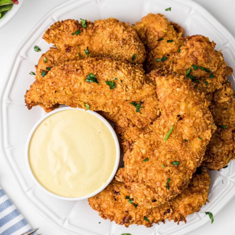 Golden, crispy Zaxby’s chicken fingers served with dipping sauce and fries.