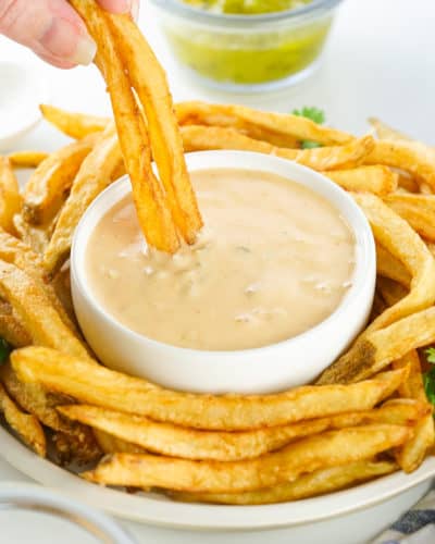 Once cooked to your liking, carefully remove the fries from the air fryer (the basket will be hot), season if desired, and serve immediately for the best flavor and texture.