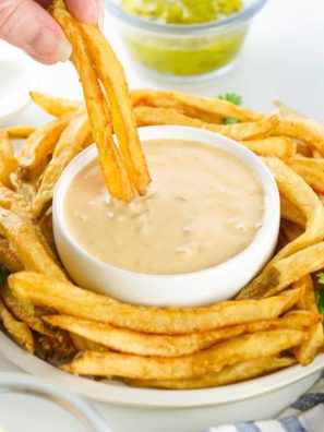 Once cooked to your liking, carefully remove the fries from the air fryer (the basket will be hot), season if desired, and serve immediately for the best flavor and texture.