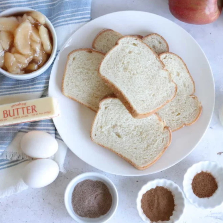 Ingredients needed for Air Fryer Apple Pie French Toast on kitchen table.