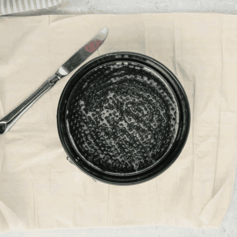 Preheating air fryer to 355°F and greasing baking dish.
