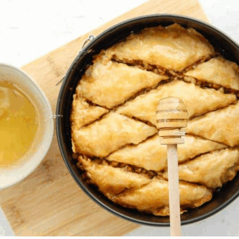 Golden brown Air Fryer Baklava squares with honey glaze and nut filling.