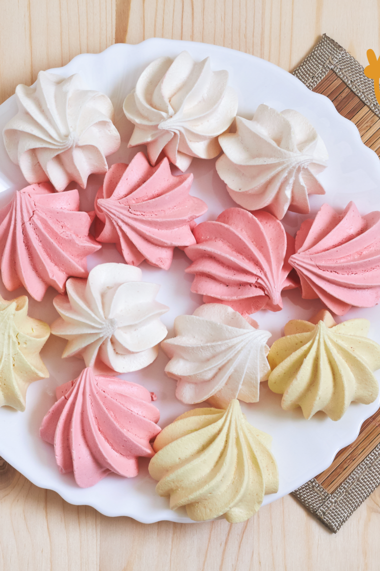 A plate of finished Air Fryer meringue cookies, showcasing their light and airy texture with a delicate golden hue.