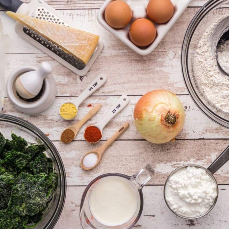 Ingredients needed for Air Fryer Spinach Quiche on kitchen table.