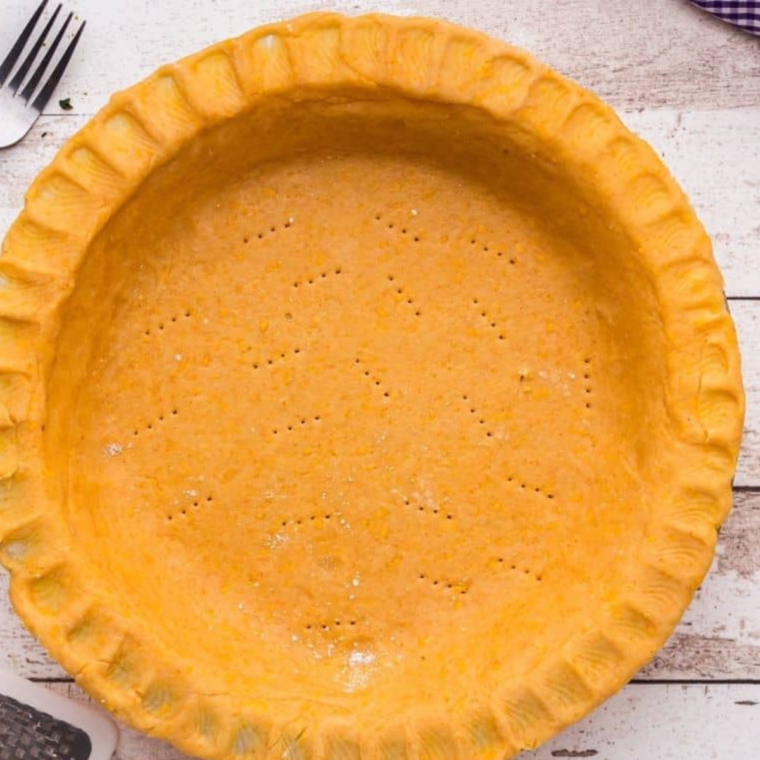 Prepared pie crust on the table.