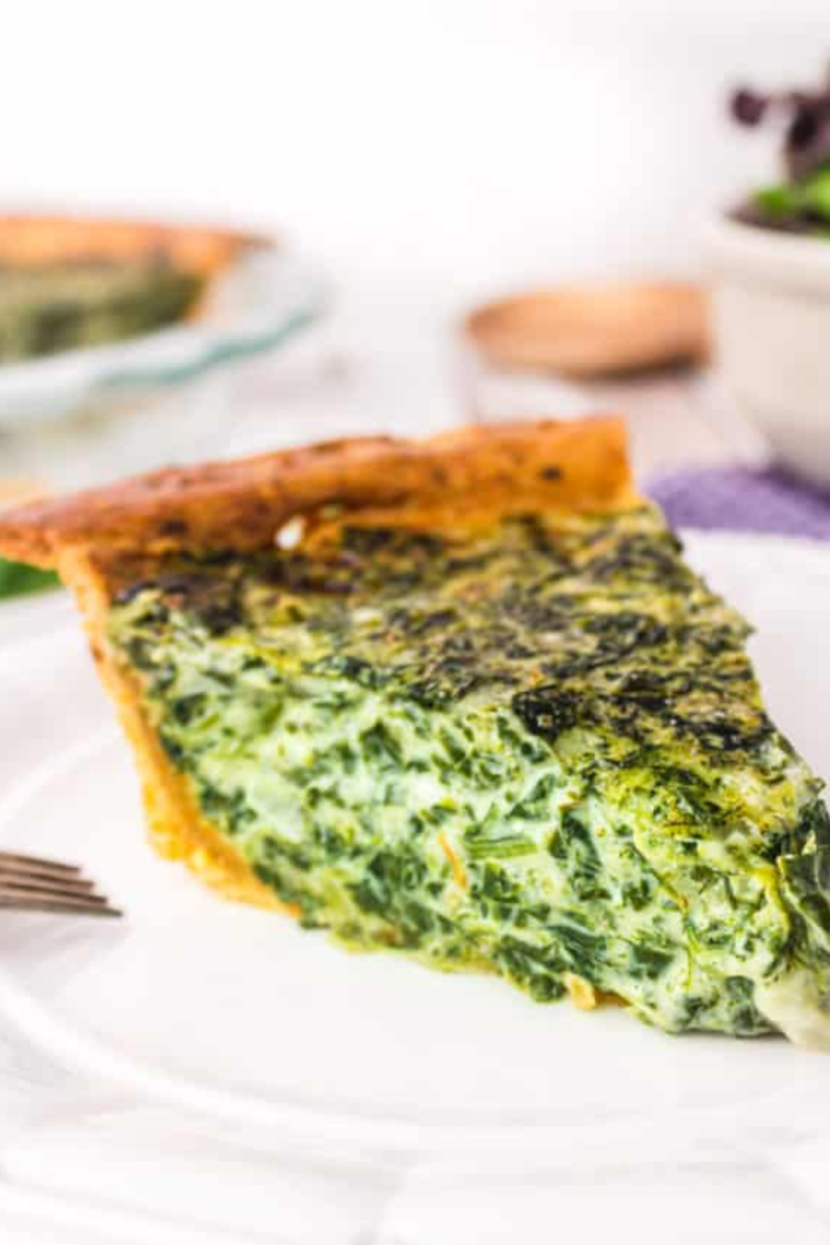 "Air Fryer Spinach Quiche sliced and served on a plate"