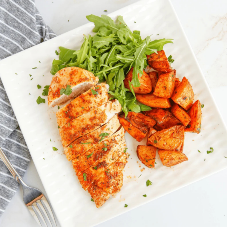 grilled chicken breast cooking on Blackstone flat top griddle