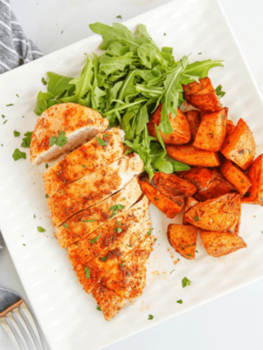 Blackstone chicken breast sizzling on a hot griddle