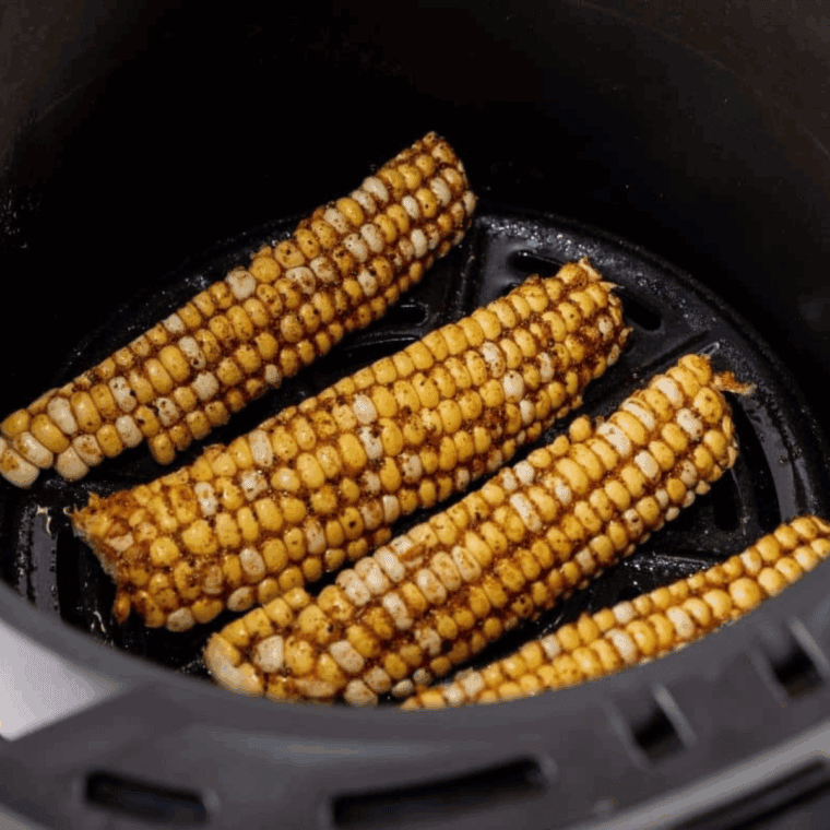  Corn rib pieces arranged in air fryer basket ready to cook.