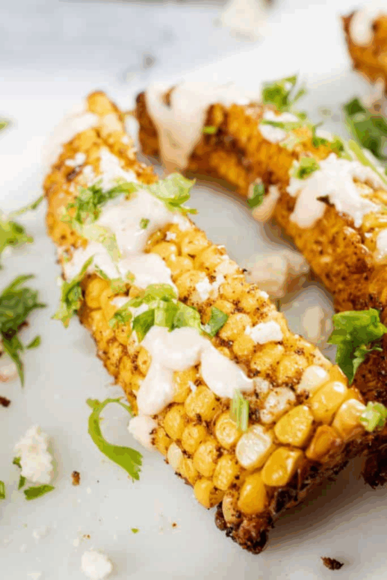Crispy air-fried corn ribs topped with chipotle mayo, cotija cheese, and cilantro.