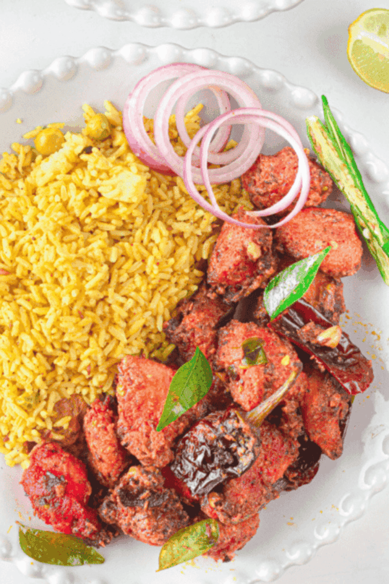 Marinated chicken pieces coated with spices and yogurt.