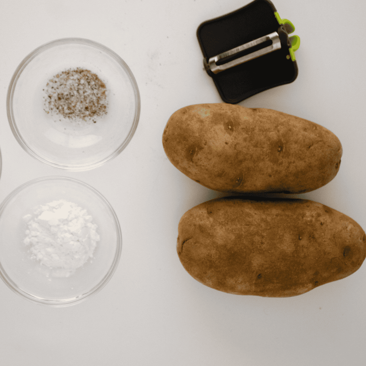 Ingredients needed for Homemade McDonald’s Hash Browns on kitchen table.