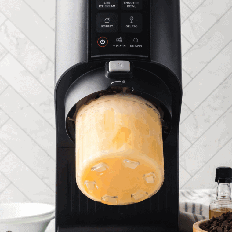 Adding water to Ninja Creami pint, locking into outer bowl, and processing on slushi mode