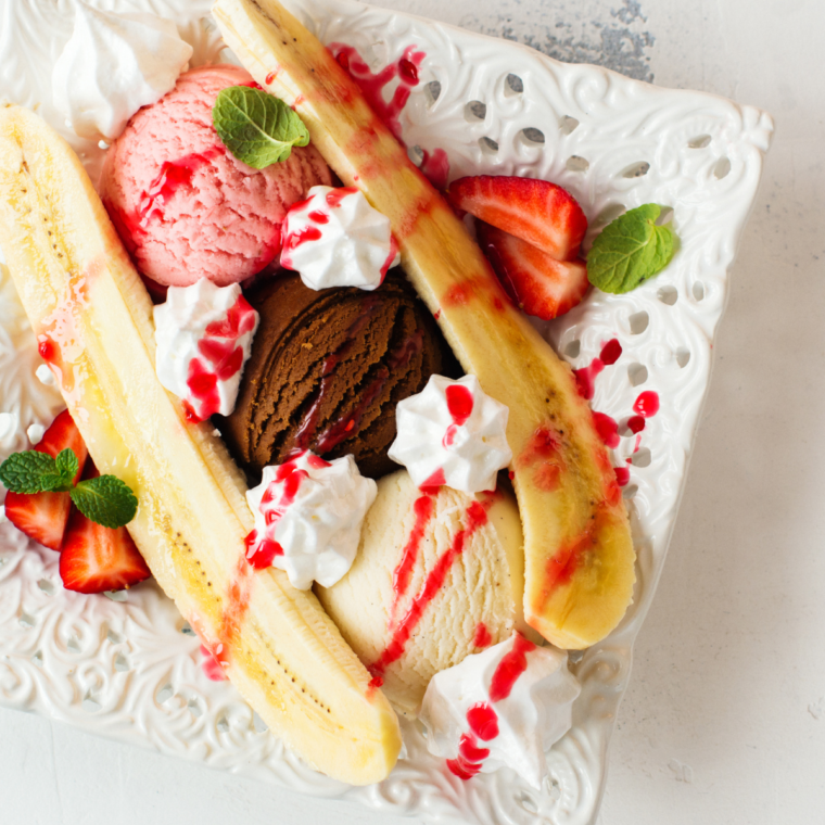 Delicious Air Fryer Banana Split topped with warm toppings, served in a bowl.