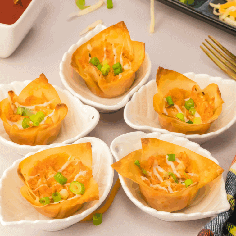 Juicy air fryer buffalo shredded chicken in a bowl, coated in spicy buffalo sauce, ready for sandwiches, wraps, or salads.