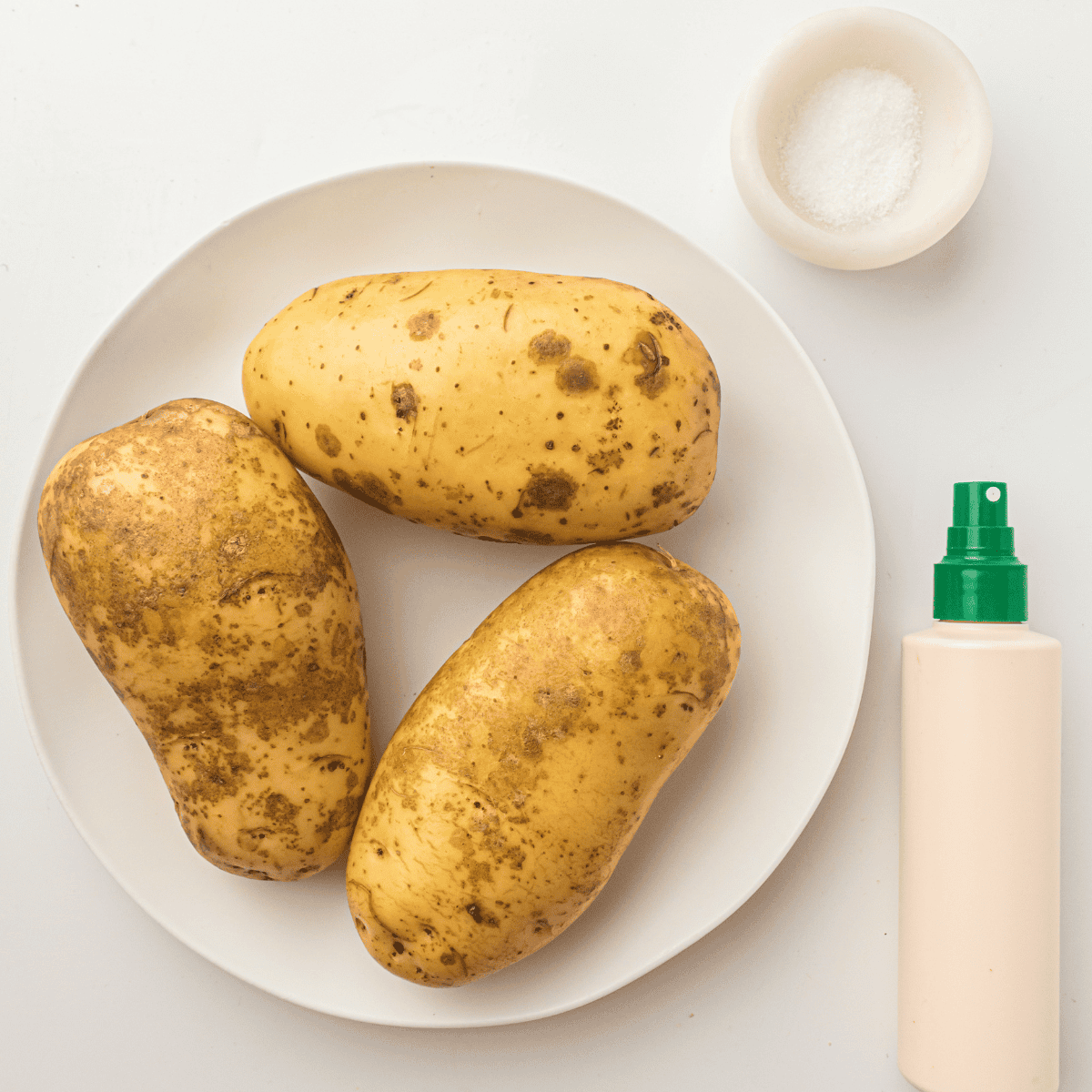 Ingredients needed for Air Fryer Cottage Fries on kitchen table.