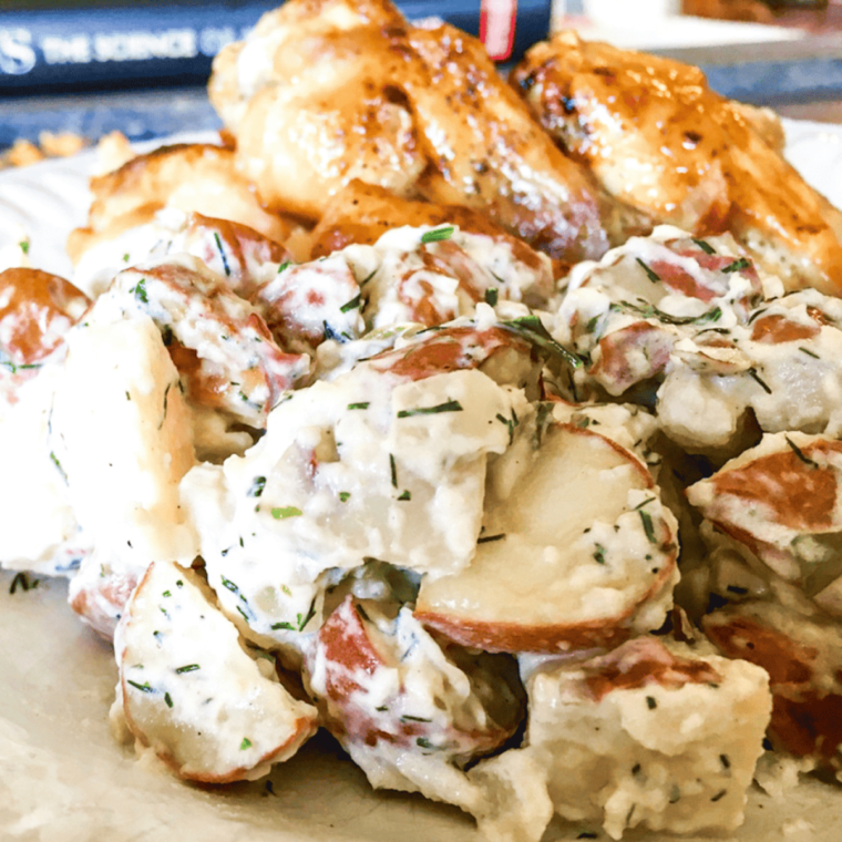 Colorful Air Fryer Potato Salad featuring roasted potatoes and vegetables.