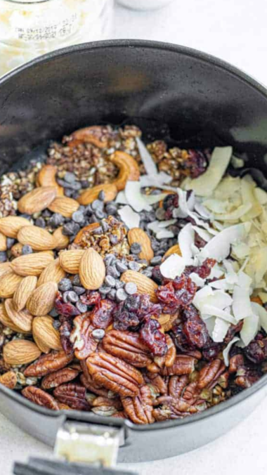 Pumpkin Granola ingredients in the air fryer basket, ready to be cooked. (air-fried)