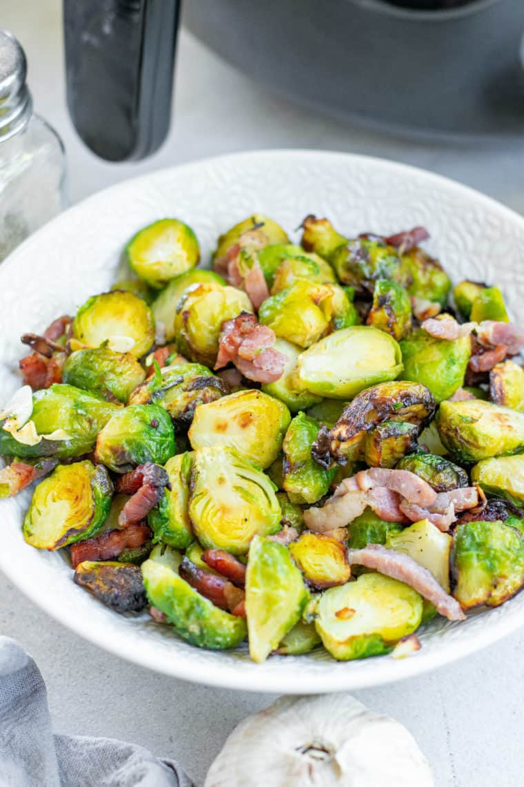 Indulge in a symphony of flavors with our "Best Air Fryer Maple Bacon Brussels Sprouts" recipe. Perfectly crispy Brussels sprouts are paired with the savory allure of bacon, all enveloped in a tantalizing maple glaze. This dish offers a delightful balance of sweetness and savory notes, all while showcasing the best of what an air fryer can achieve. Whether you're a Brussels sprouts skeptic or aficionado, this recipe promises to be a game-changer for your culinary repertoire. Dive in and let your taste buds be enthralled!