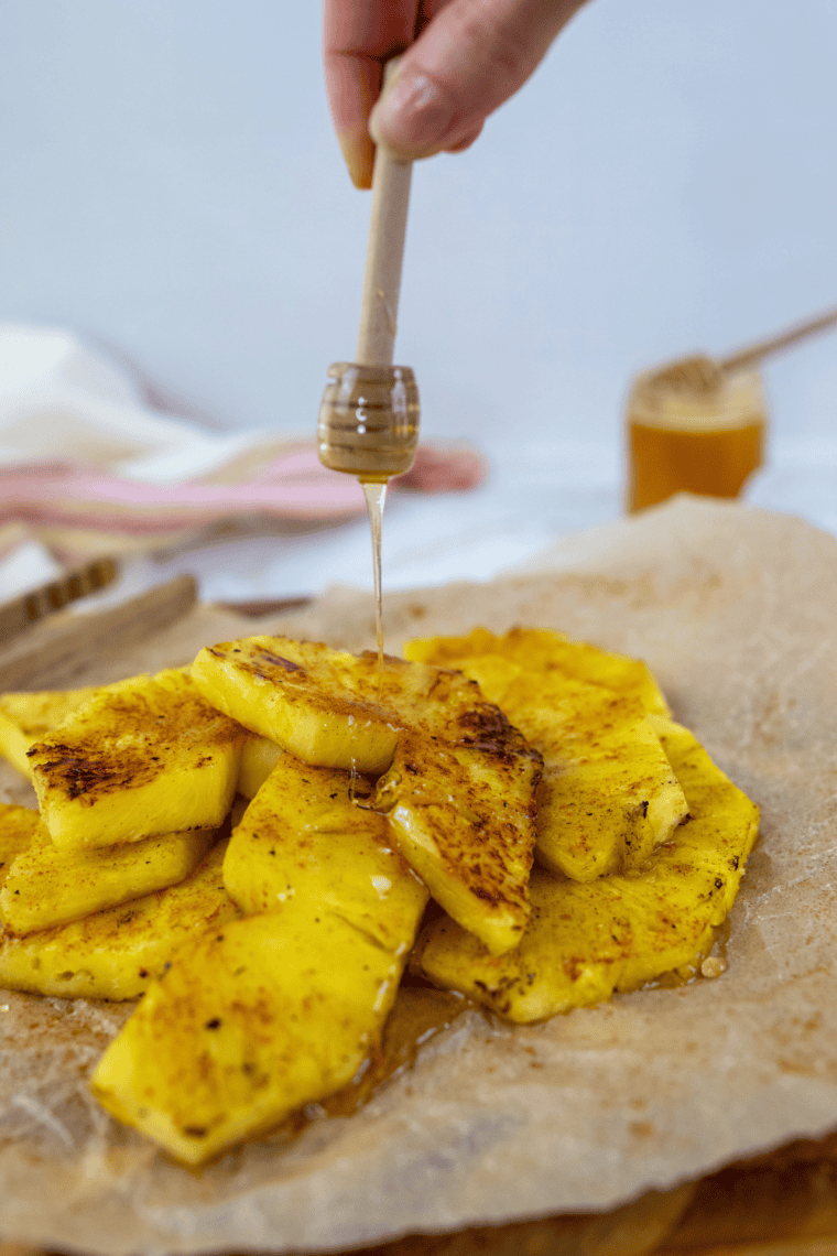 Golden pineapple slices caramelized on a Blackstone griddle, ready to serve