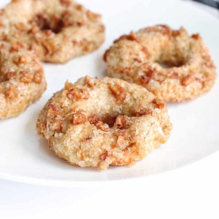 Placing bagels in the oven to warm up and achieve a fresh-baked texture