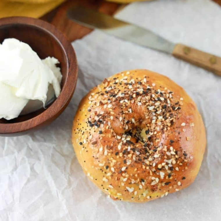 Plate of reheated bagels with a golden-brown, crispy exterior and a warm, soft center