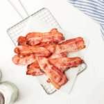 Crispy Bar-S sliced bacon cooked in an air fryer basket, ready to serve.
