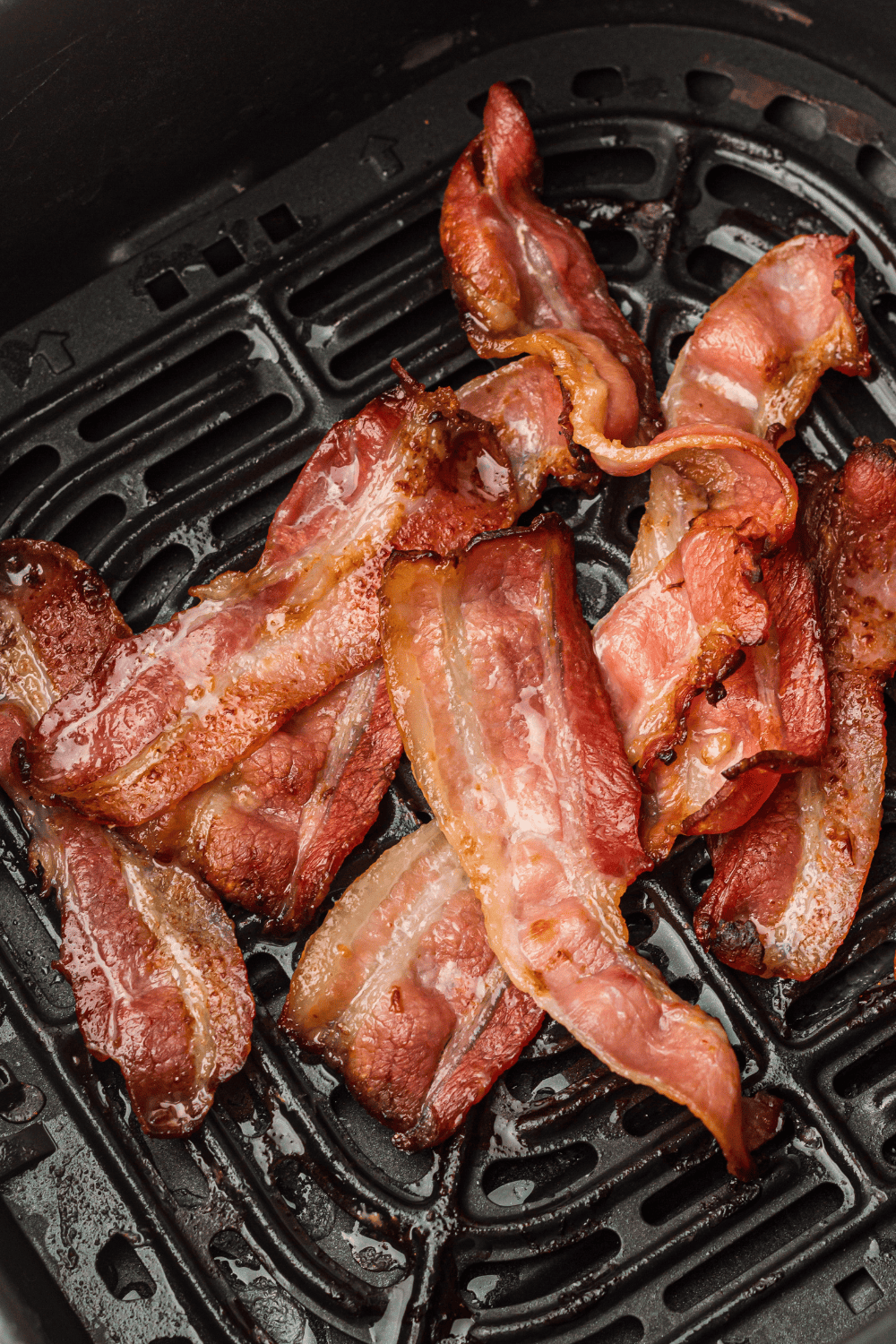 Bar-S sliced bacon cooked to a crispy finish in an air fryer basket.