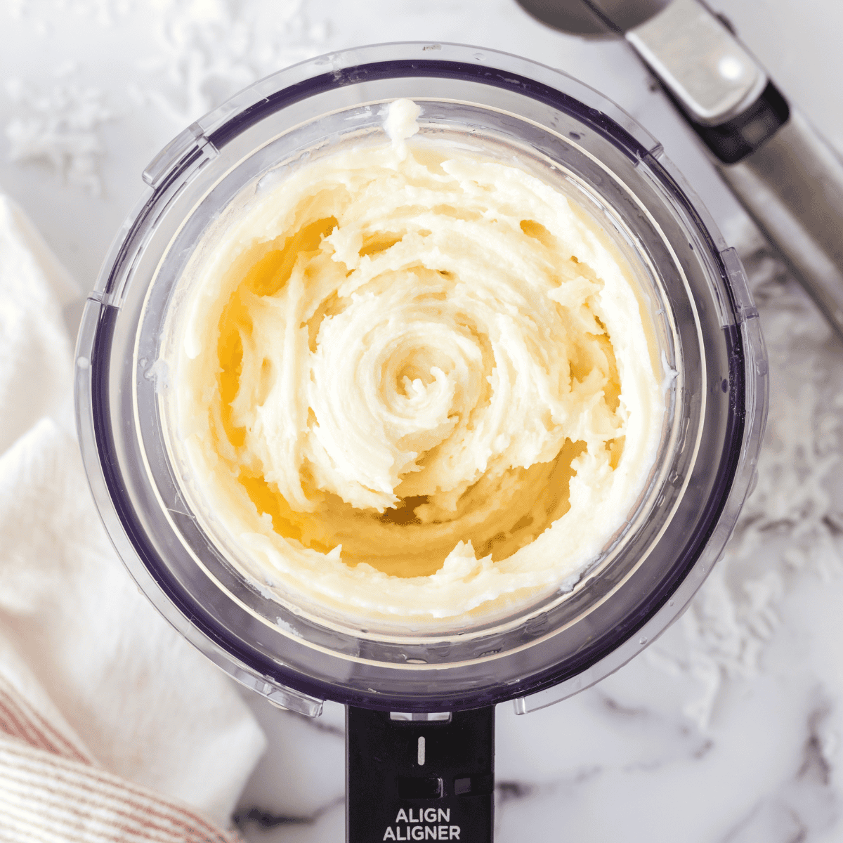 Process the frozen ice cream in the Ninja Creami, then add toffee bits to the center and use the "Mix-In" function to blend them in.