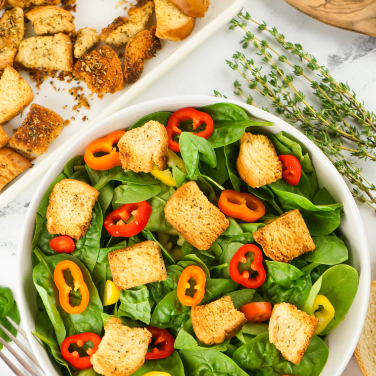 Air Fryer Croutons on top of a garden salad.