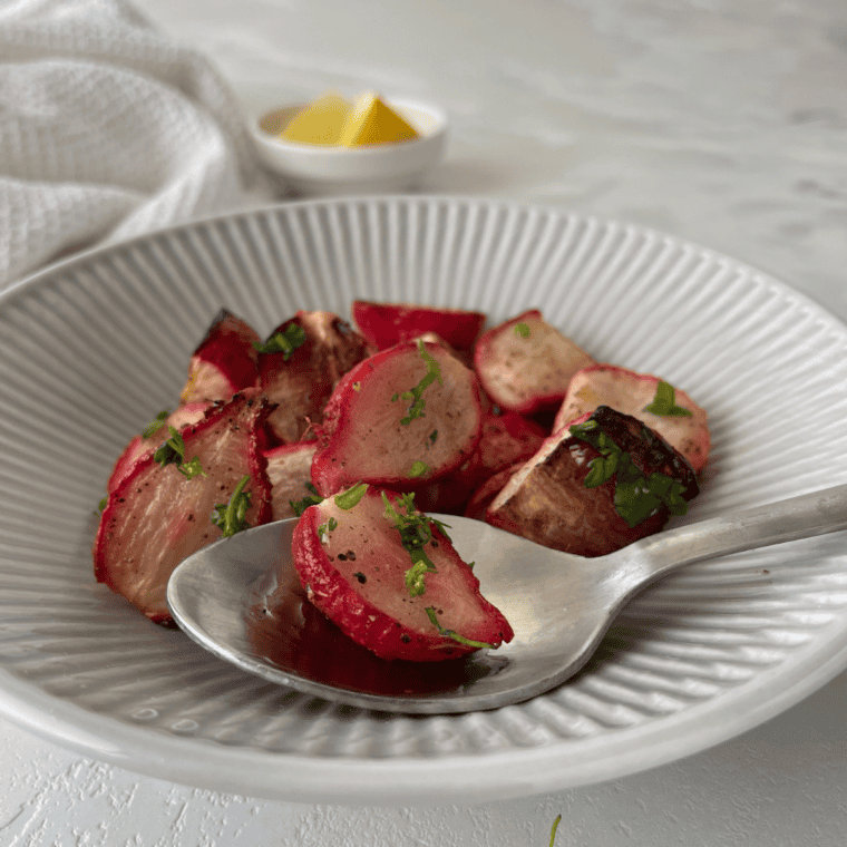 A serving of crispy, golden Air Fryer Roasted Radishes in a bowl.