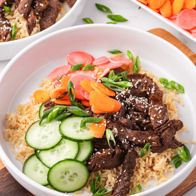 Air Fryer Trader Joe's Bool Kogi served over white rice with saut&eacute;ed vegetables