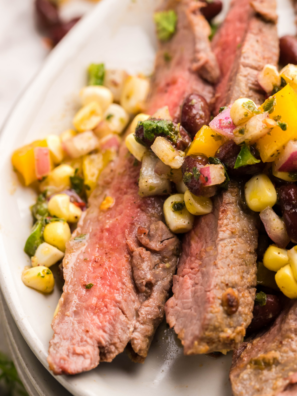 Sliced Blackstone flank steak with grill marks on a flat top griddle