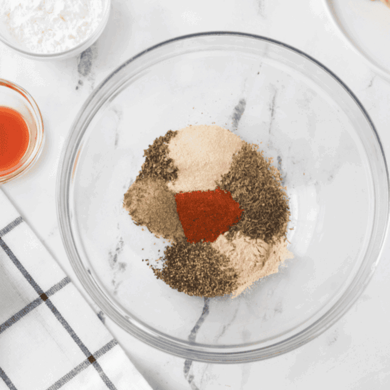 Mix the herbs and seasoning mix in a small mixing bowl.