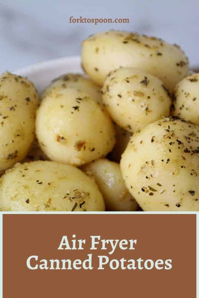 Close up of cooked canned potatoes with overlay text reading "Air Fryer Canned Potatoes" 