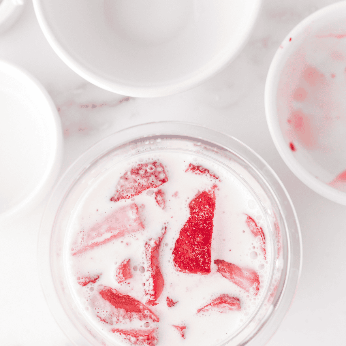 Place the Ninja Creami Strawberry Ice Cream With Condensed Milk ingredients into the Ninja Creami pint container.