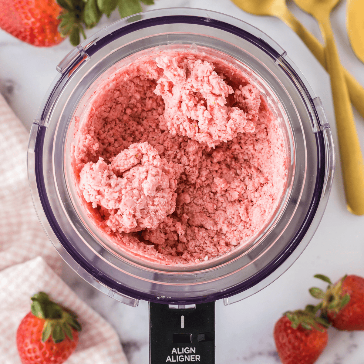 Ninja Creami Strawberry Ice Cream With Condensed Milk in the Ninja Pint Container.