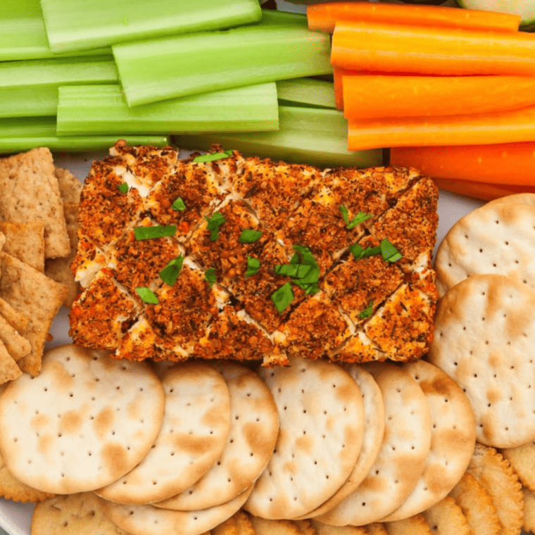 Smoked cream cheese on a Traeger grill with a smoky golden crust.